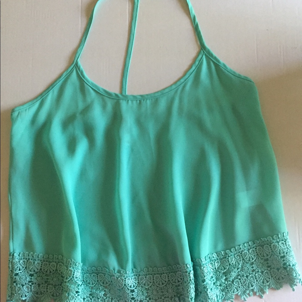 Teal colored tank with detailed bottom